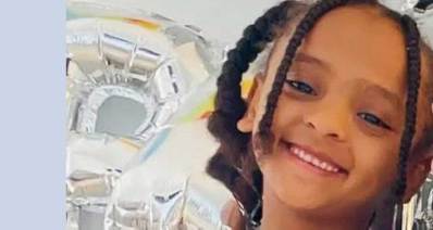 היימנוט קסאו, תמונת פנים. מחייכת וצמות בשיער.